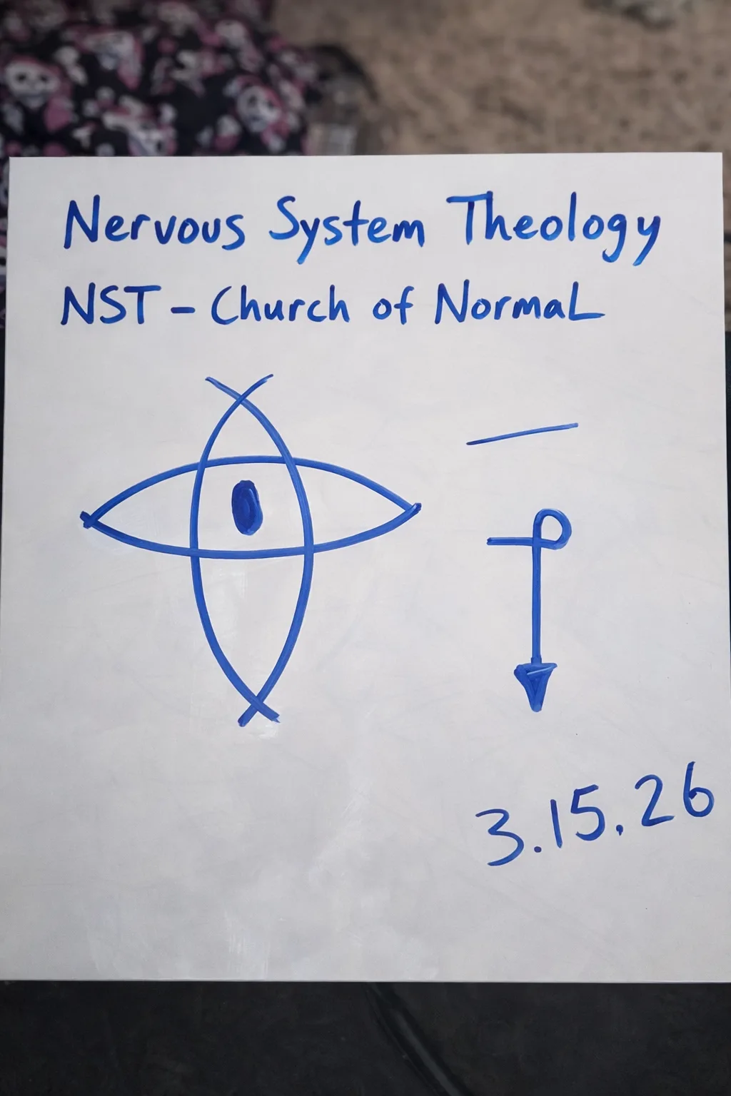 Whiteboard photo — the NST eye sigil and the loop sigil hand-drawn in blue marker, dated 3.15.26